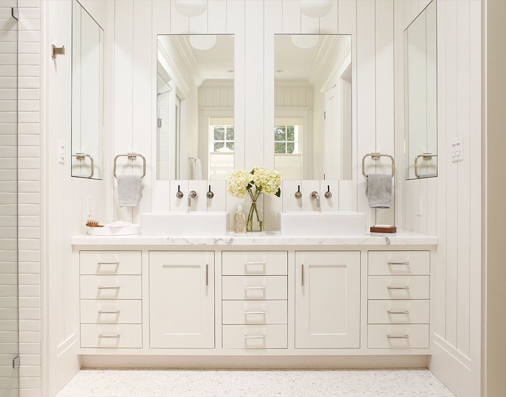 Lefroy Brooks for a Traditional Bathroom with a Black Rock and Master Bathroom, White Vanity with Two Sinks and Large Mirrors by Rasmussen Construction