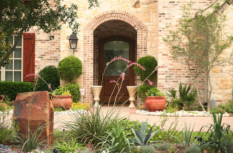 Lowes Dallas for a Traditional Landscape with a Brick Arch and Water Efficient Landscape Renovation by Verdant Grounds