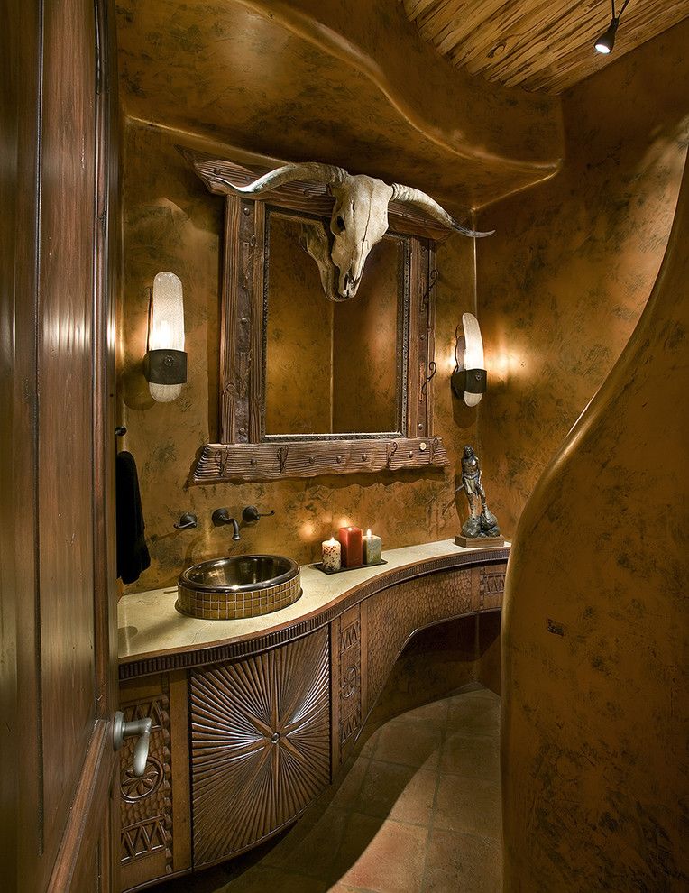 Sconces Definition for a Southwestern Powder Room with a Decorative Carving and Powder Bath by Bess Jones Interiors